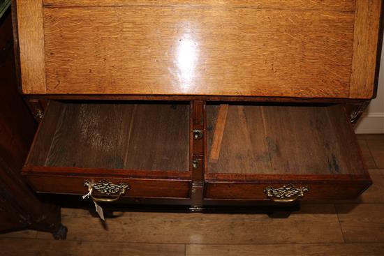 A George III oak bureau, W.91cm